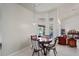Cozy breakfast nook with a wooden table and chairs, offering serene views of the outdoors at 12300 Drake Ln, Spring Hill, FL 34609