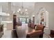 Open dining space offers views of the pool and access to the kitchen and living areas at 12300 Drake Ln, Spring Hill, FL 34609