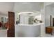 Bright kitchen featuring white cabinets, stainless appliances, and breakfast bar at 12300 Drake Ln, Spring Hill, FL 34609