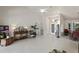Open-concept living area with tile flooring and a view of the entryway at 12300 Drake Ln, Spring Hill, FL 34609
