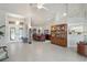 Open concept living room and dining room area with tall ceilings and large windows at 12300 Drake Ln, Spring Hill, FL 34609