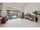 Bright living room with large sliding glass doors offering views of the pool and backyard at 12300 Drake Ln, Spring Hill, FL 34609