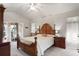Bright main bedroom featuring a ceiling fan, and a sliding glass door to the outdoor space at 12300 Drake Ln, Spring Hill, FL 34609