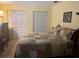 Cozy bedroom featuring a comfortable bed with a colorful quilt at 1332 Inca Ave, Spring Hill, FL 34608
