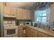 Functional kitchen with ample counter space and wood cabinets at 1332 Inca Ave, Spring Hill, FL 34608