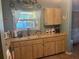 Functional kitchen features wood cabinets and countertops at 1332 Inca Ave, Spring Hill, FL 34608