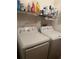 Bright laundry room with white washer and dryer at 1332 Inca Ave, Spring Hill, FL 34608