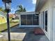 Enjoy the breeze on the shaded and screened back porch at 13811 Michelle Ave, Hudson, FL 34667