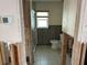 Under-renovation bathroom featuring a shower and toilet at 13811 Michelle Ave, Hudson, FL 34667