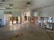 Large garage that has been framed and partially renovated, with white paint and exposed studs at 13811 Michelle Ave, Hudson, FL 34667