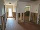 Hallway with neutral paint color, flooring and access to rooms at 13811 Michelle Ave, Hudson, FL 34667