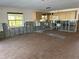 Open-concept kitchen featuring ample cabinetry and natural light at 13811 Michelle Ave, Hudson, FL 34667