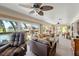 Bright living room with water view features comfortable seating and stylish decor at 13811 Michelle Ave, Hudson, FL 34667