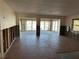Spacious living room featuring water views from the glass doors to the outdoor canal at 13811 Michelle Ave, Hudson, FL 34667