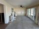 Spacious sun room with natural light featuring access to the outdoors at 13811 Michelle Ave, Hudson, FL 34667