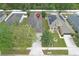 Aerial view of home and its well-maintained front yard and driveway at 14581 Wake Robin Dr, Brooksville, FL 34604