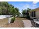 Fenced backyard featuring low maintenance landscaping and open patio at 14581 Wake Robin Dr, Brooksville, FL 34604