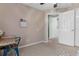 Cozy bedroom with neutral carpet, desk and bright natural light at 14581 Wake Robin Dr, Brooksville, FL 34604