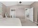 Tranquil bedroom featuring neutral tones, a sign that says 