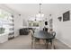 Inviting open-plan dining area and living room with streaming natural light and contemporary furnishings at 14581 Wake Robin Dr, Brooksville, FL 34604