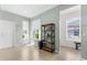 Light and bright entryway with white door and neutral walls with tile floors and window at 14581 Wake Robin Dr, Brooksville, FL 34604