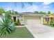 Inviting single-Gathering home with a two-car garage, manicured lawn, and tasteful landscaping at 14581 Wake Robin Dr, Brooksville, FL 34604