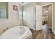 Bright bathroom featuring a soaking tub with tile accents and seamless access to the shower at 15912 42Nd E Gln, Parrish, FL 34219
