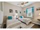 Cozy bedroom featuring two twin beds, decorative pillows, and bright natural lighting at 15912 42Nd E Gln, Parrish, FL 34219