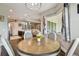 Cozy dining area adjacent to the kitchen featuring a round table and bay window with natural light at 15912 42Nd E Gln, Parrish, FL 34219
