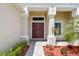 Grand entrance featuring a double door entry and elegant columns, framed by beautiful landscaping at 15912 42Nd E Gln, Parrish, FL 34219
