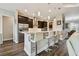 Eat-in kitchen featuring stainless steel appliances, dark wood cabinetry, and bar seating at 15912 42Nd E Gln, Parrish, FL 34219