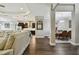 Open-concept living space seamlessly flows into kitchen and dining area with hardwood flooring at 15912 42Nd E Gln, Parrish, FL 34219