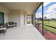 Relaxing screened patio with comfortable seating overlooking the well-maintained backyard at 15912 42Nd E Gln, Parrish, FL 34219