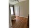 Bedroom with wood floors, ceiling fan, standard closet, and a window with privacy blinds at 1704 Winn Arthur Dr, Valrico, FL 33594