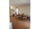 Open dining room with space for six or more, with a simple decor and neutral paint at 1704 Winn Arthur Dr, Valrico, FL 33594