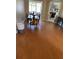 An open concept dining room with a wood table and seating for six with luxury vinyl flooring at 1704 Winn Arthur Dr, Valrico, FL 33594