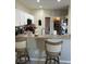 Open kitchen with white cabinets, stainless steel appliances, breakfast bar, and a walk-in pantry at 1704 Winn Arthur Dr, Valrico, FL 33594