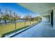 Spacious balcony with stunning views of the lake and green landscape at 18725 Jiretz Rd, Odessa, FL 33556