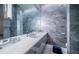 Modern bathroom with marble countertops, sleek gray tiles, and contemporary fixtures, providing a spa-like experience at 18725 Jiretz Rd, Odessa, FL 33556