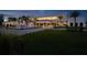 Contemporary home with sleek design, impressive fountains, lush landscaping, and manicured lawn at 18725 Jiretz Rd, Odessa, FL 33556