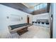 Open-concept game room with a pool table and modern kitchen bar at 18725 Jiretz Rd, Odessa, FL 33556