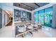 Modern kitchen featuring a spacious island with bar seating, sleek cabinetry, and high-end appliances at 18725 Jiretz Rd, Odessa, FL 33556