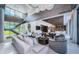 Elegant living space with luxury seating, high ceilings, and a staircase leading to the upper level at 18725 Jiretz Rd, Odessa, FL 33556