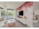 Light and airy main bedroom boasts an adjacent sitting area, walkout balcony and artistic wallpaper at 18725 Jiretz Rd, Odessa, FL 33556