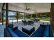 A covered outdoor seating area featuring a beautiful view of the lake at 18725 Jiretz Rd, Odessa, FL 33556