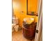 Unique bathroom featuring a vessel sink, decorative vanity, and a bright yellow wall at 2349 Holston Ave, Spring Hill, FL 34608
