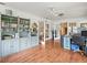 Bonus room with custom built-in shelving, wood floors, and lots of natural light at 24104 Peppermill Dr, Brooksville, FL 34601