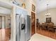 Kitchen with stainless steel appliances, tile floor, and connection to the dining area at 24104 Peppermill Dr, Brooksville, FL 34601