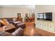 Spacious living room features hardwood flooring, an open floor plan and eat in dining at 24104 Peppermill Dr, Brooksville, FL 34601