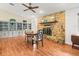 Living room features a stone fireplace, wood floors, and built-in bookcases at 24104 Peppermill Dr, Brooksville, FL 34601